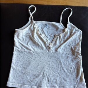 Brandy Melville Cream Tank with Subtle Pattern of light dusty rose flowers.